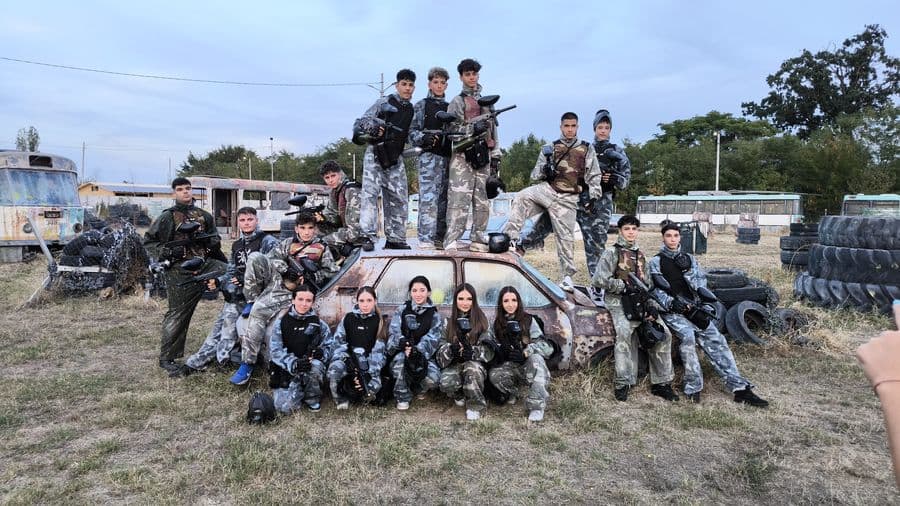 Group of players next to the wrecked car, Area 51 field